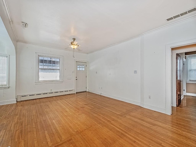 interior space with ceiling fan, baseboard heating, and light hardwood / wood-style floors