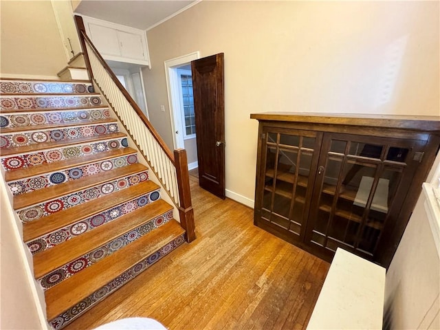 stairway with hardwood / wood-style flooring