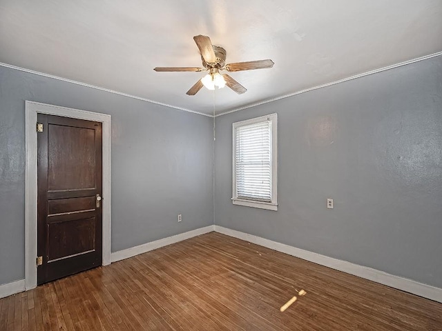 unfurnished room with hardwood / wood-style flooring and ceiling fan