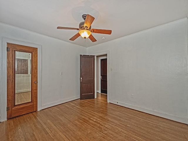 unfurnished room with ceiling fan and light wood-type flooring