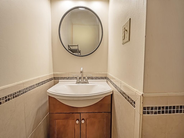 bathroom with tile walls and vanity