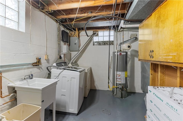 washroom with gas water heater, sink, electric panel, and independent washer and dryer