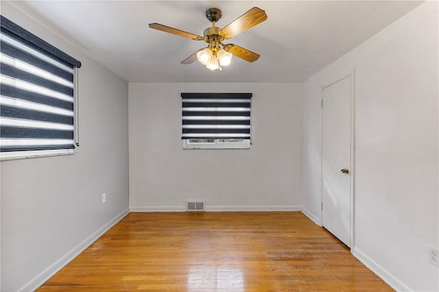 spare room with ceiling fan and light hardwood / wood-style floors