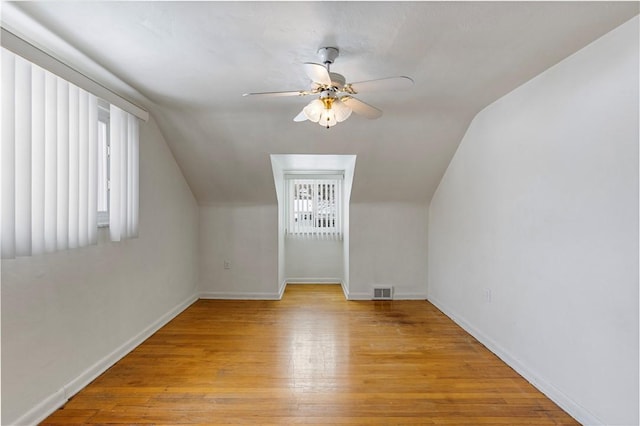 bonus room with lofted ceiling, ceiling fan, and light hardwood / wood-style flooring