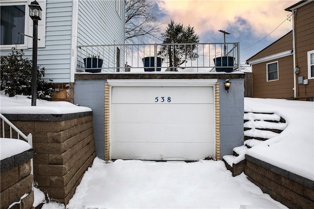 view of snow covered garage