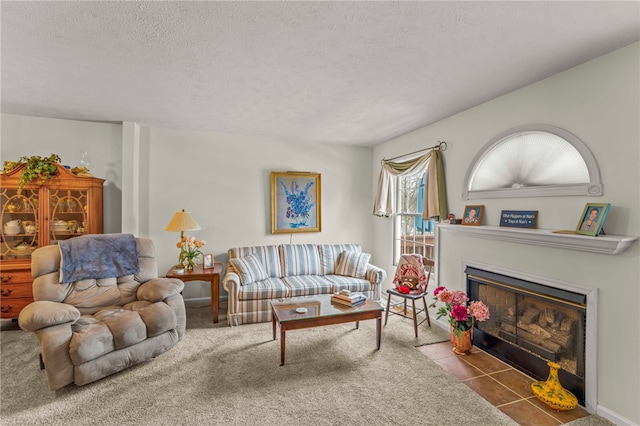 tiled living room featuring a textured ceiling