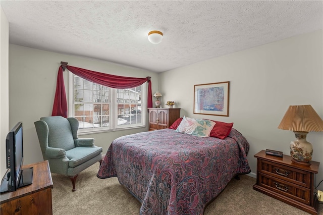 carpeted bedroom featuring a textured ceiling