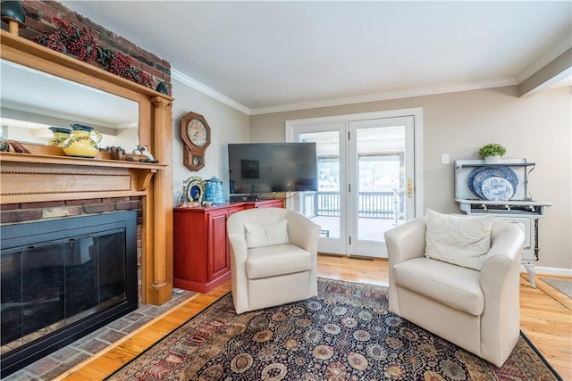 living room with ornamental molding and wood-type flooring