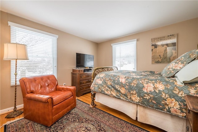 bedroom with hardwood / wood-style floors