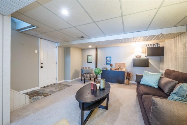 carpeted living room featuring a paneled ceiling, recessed lighting, visible vents, and baseboards