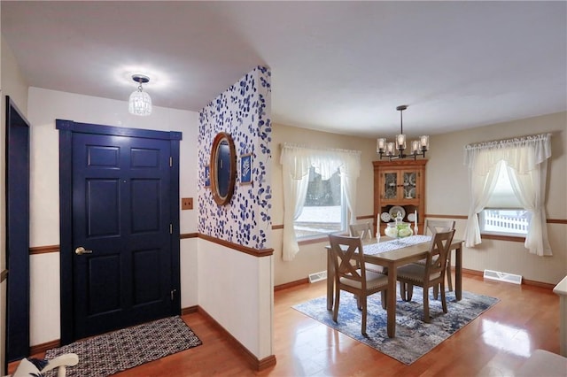 entrance foyer with a chandelier and hardwood / wood-style flooring