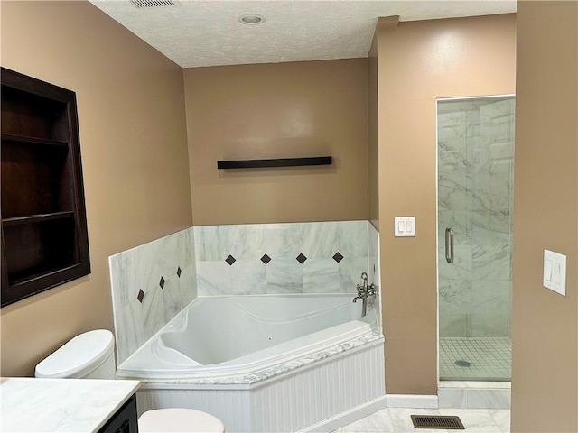 bathroom with tile patterned flooring, a textured ceiling, shower with separate bathtub, and vanity