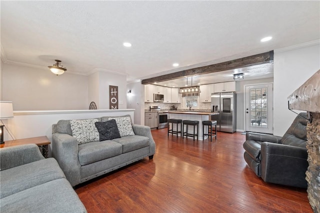 living room with beam ceiling, crown molding, and dark hardwood / wood-style floors