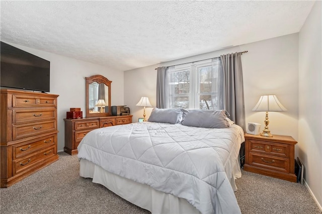 carpeted bedroom featuring a textured ceiling