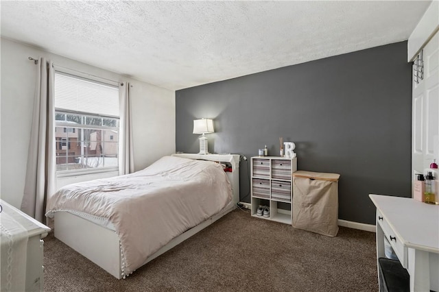 carpeted bedroom with a textured ceiling