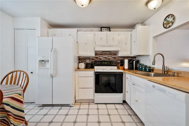 kitchen featuring white appliances, white cabinets, decorative backsplash, and sink