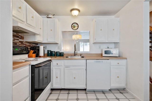 kitchen featuring white appliances, pendant lighting, sink, white cabinetry, and tasteful backsplash