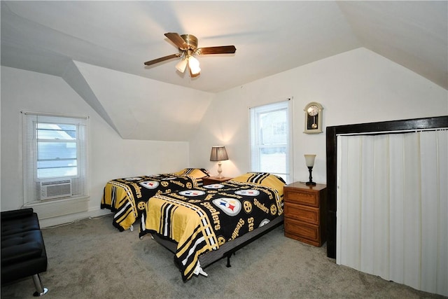 bedroom with vaulted ceiling, ceiling fan, and carpet