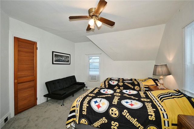 carpeted bedroom featuring lofted ceiling, ceiling fan, cooling unit, and a closet