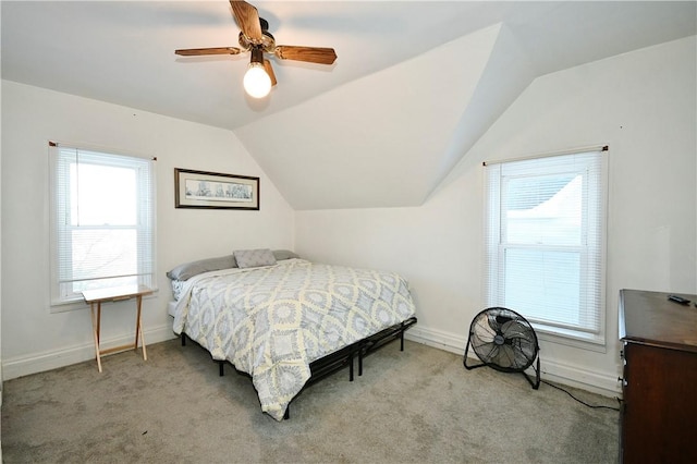 carpeted bedroom featuring lofted ceiling and ceiling fan