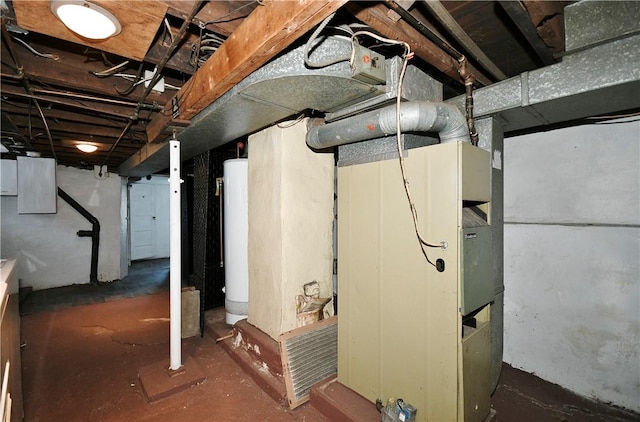 basement featuring heating unit and water heater