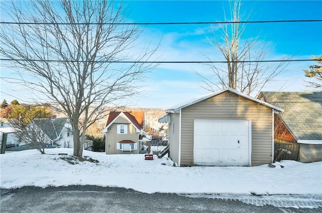 view of snow covered garage