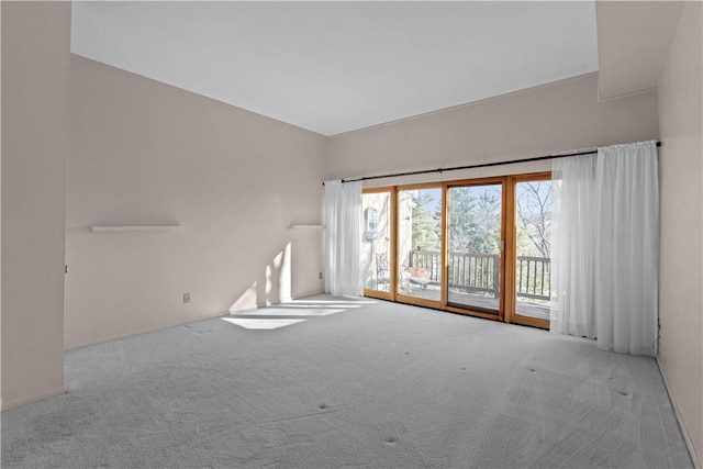 carpeted empty room featuring plenty of natural light