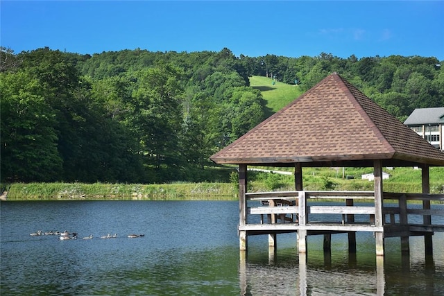 view of dock with a water view and a gazebo