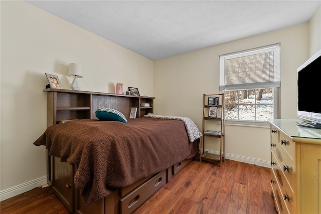 bedroom featuring wood-type flooring