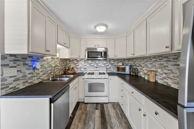 kitchen with sink, white cabinetry, and appliances with stainless steel finishes