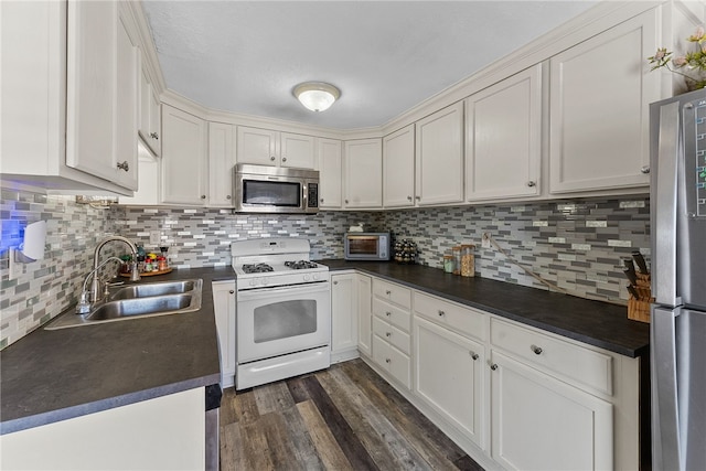 kitchen with sink, white cabinets, and appliances with stainless steel finishes