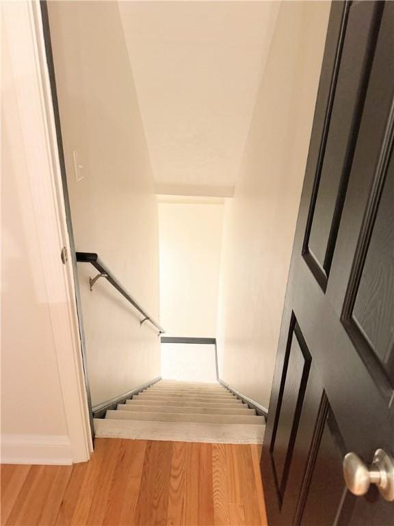 stairway featuring hardwood / wood-style flooring