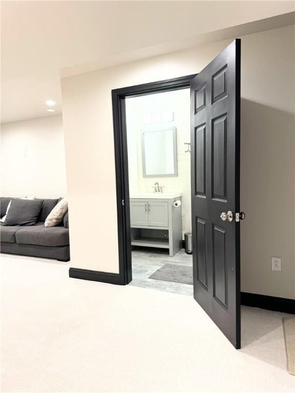 interior space with ensuite bath and sink