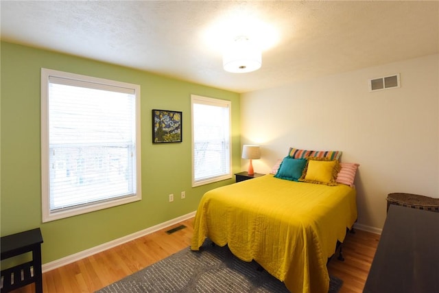 bedroom featuring hardwood / wood-style flooring