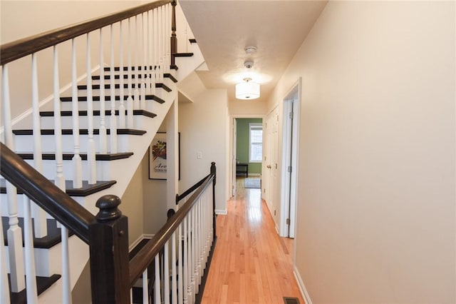 corridor featuring light hardwood / wood-style floors