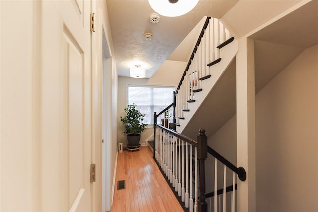 hallway featuring hardwood / wood-style flooring