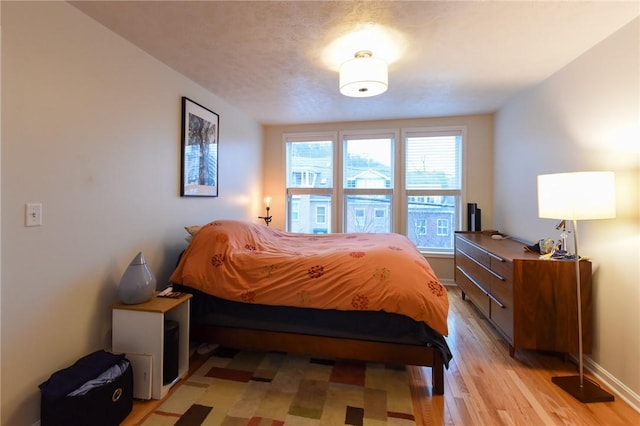 bedroom with light hardwood / wood-style flooring