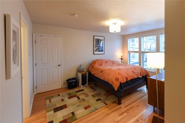 bedroom with light hardwood / wood-style floors