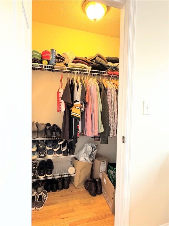 walk in closet featuring hardwood / wood-style floors