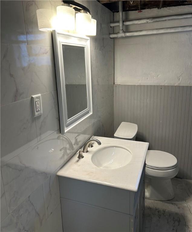 bathroom with vanity and toilet