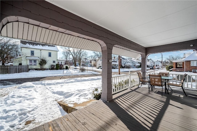 view of snow covered deck