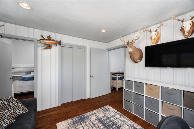 bedroom with dark wood-type flooring