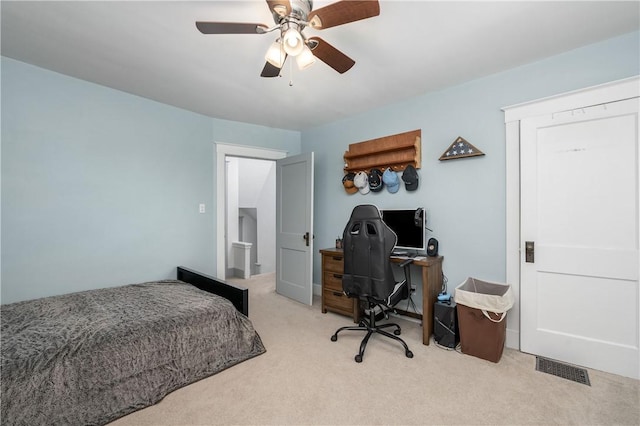 carpeted bedroom with ceiling fan