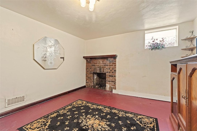 living room with a brick fireplace