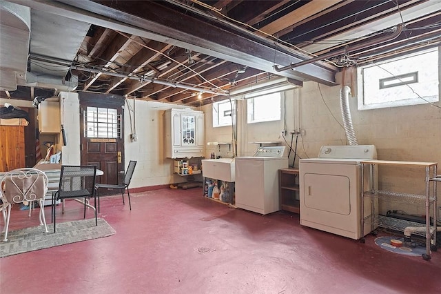 basement featuring independent washer and dryer and a healthy amount of sunlight