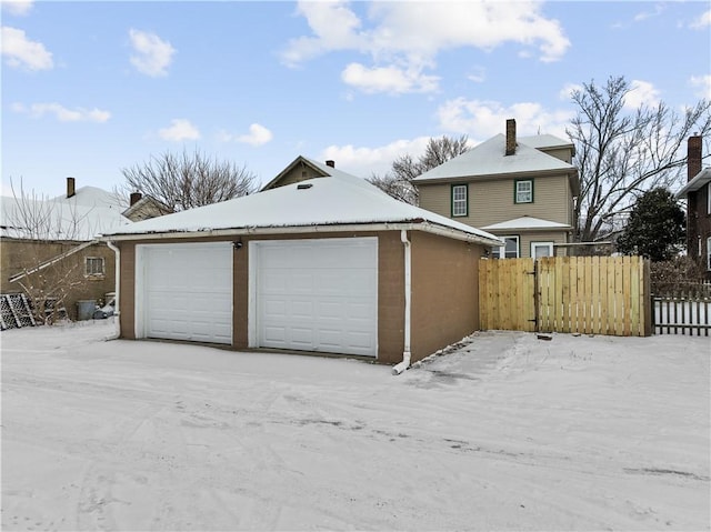 view of snow covered garage