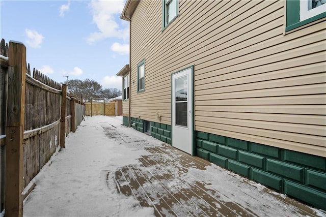 view of property exterior with a deck