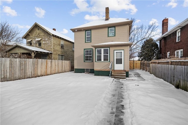 view of snow covered house