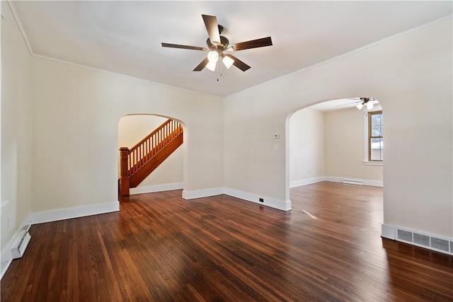 unfurnished room featuring ceiling fan, dark hardwood / wood-style floors, and a baseboard heating unit