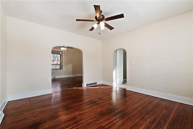 unfurnished room with dark hardwood / wood-style flooring and ceiling fan